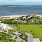 Premium Photo | Luxury Waterfront Property on Cliff Overlooking Water